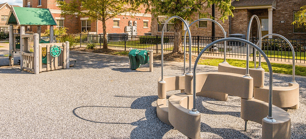a playground with a swing set and other playground equipment