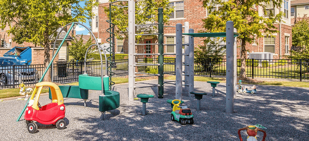 a playground with toys in front of Cumberland Manor Metropolitan Village