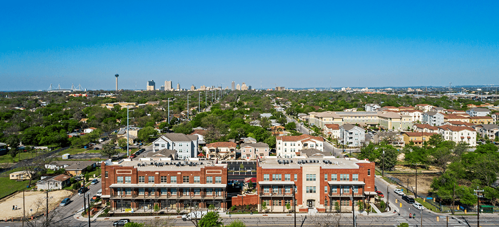 an aerial view of the city with the city skyline in the background