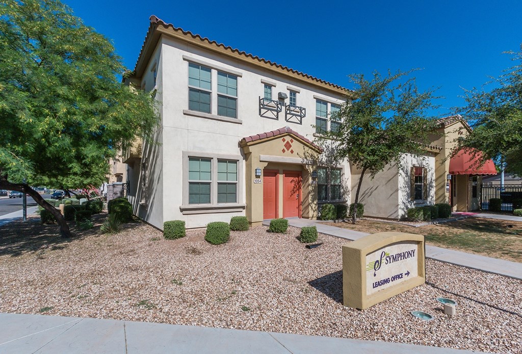 A building with a sign that says "Symphony" in front of it.