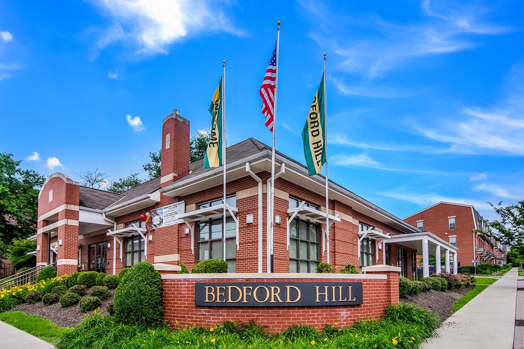 Bedford Hill building with American flag on top.