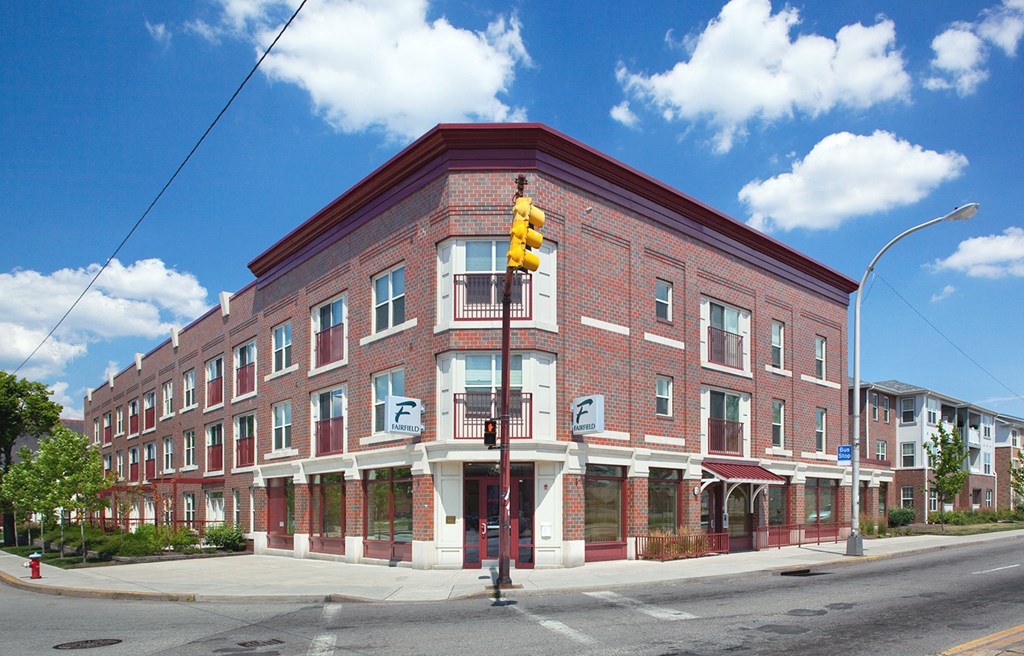 a red brick building on the corner of a street