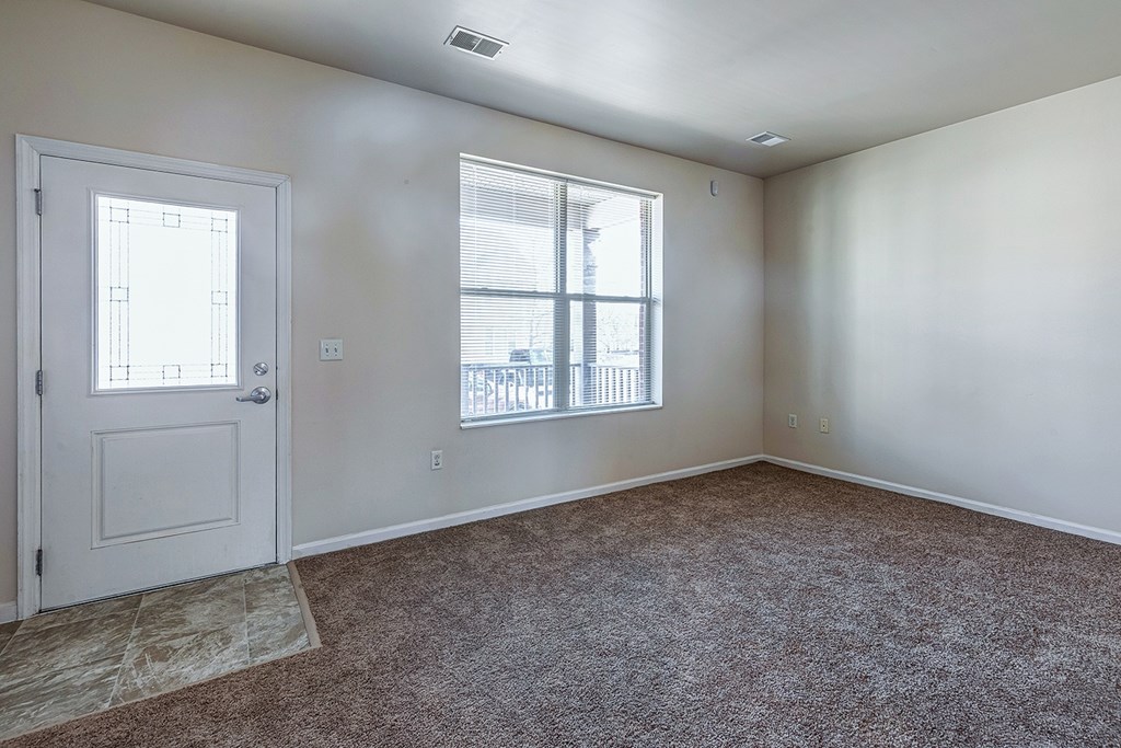 A room with a door and a window.