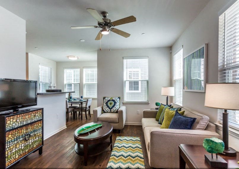 a living room with a couch and a tv