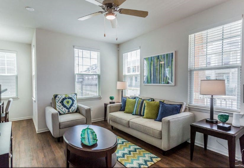 a living room with a couch and a table