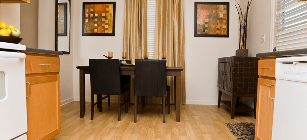 an image of a dining room with a table and chairs