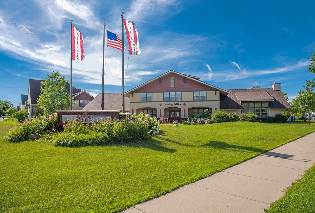 the front of a building flags in front of it