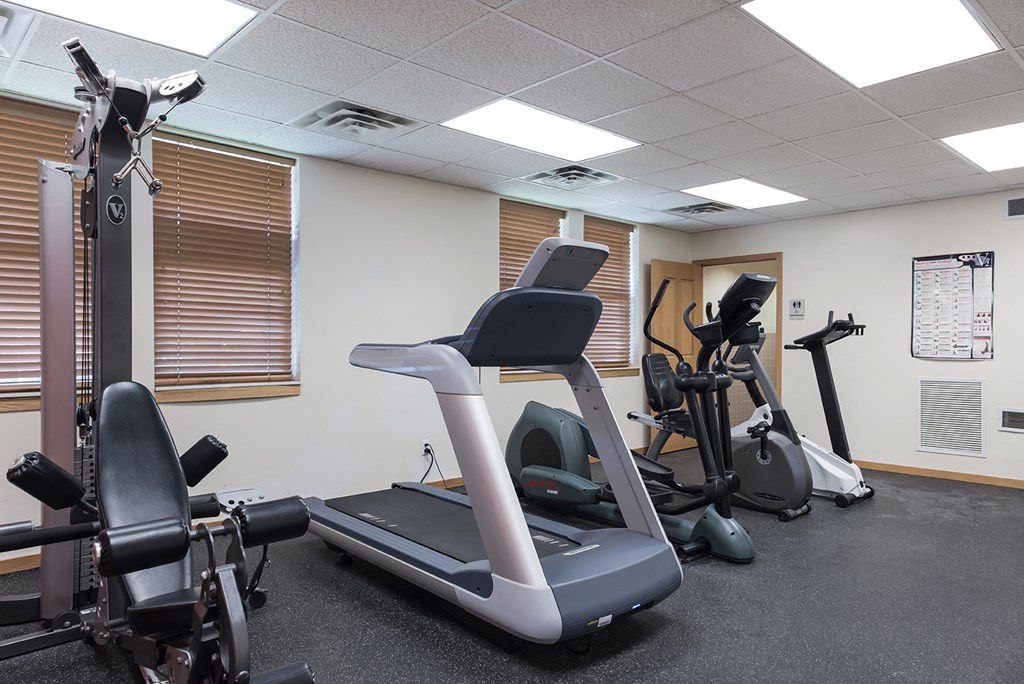 a gym with various exercise machines and weights