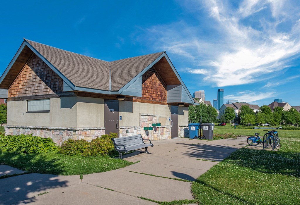 a building with a bench and a bike parked in front of it