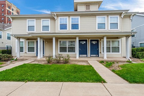 the front of a house with a sidewalk in front of it at Horace Mann apartments and townhomes in Gary, IN