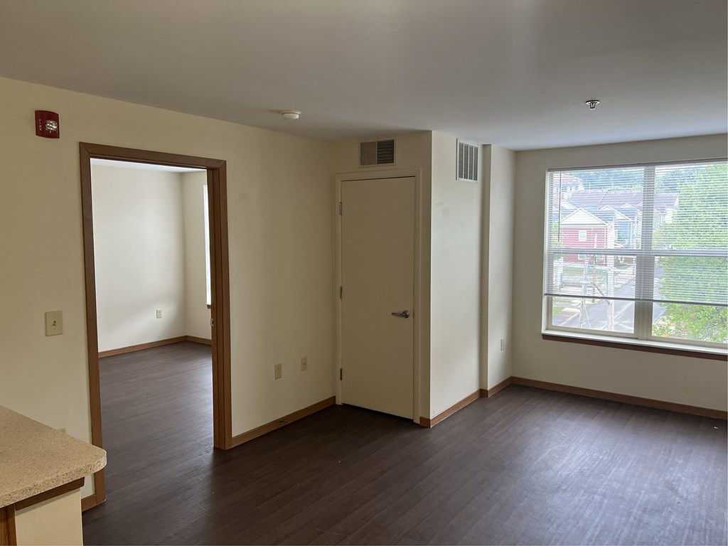 A room with a door and a window.