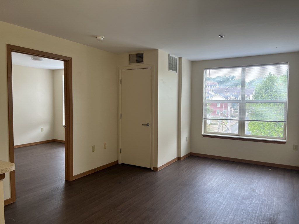 A room with a door and a window.