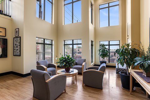 A living room with grey chairs and a coffee table.