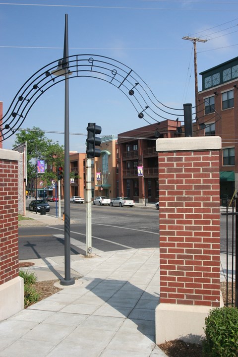 Music arc with brick pillars-Highland Place, Kansas City, MO