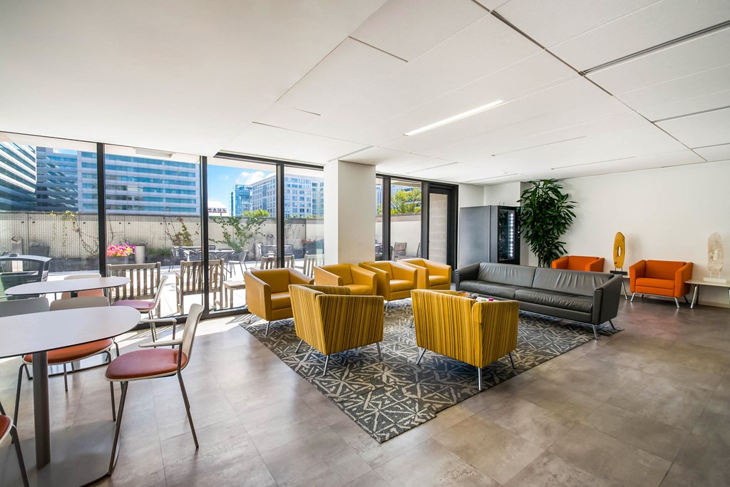 A modern office space with a large window overlooking the city.