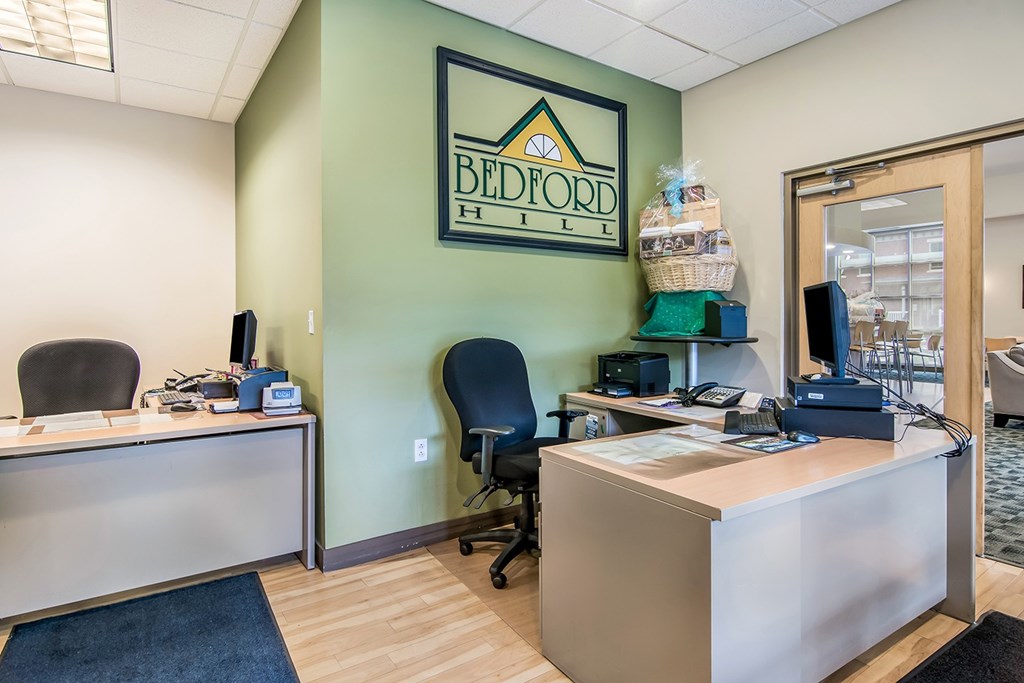 A green office with a sign that says "Belford Hill".