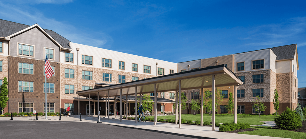 Legacy Pointe at Poindexter apartments, a building with an flag in front of it