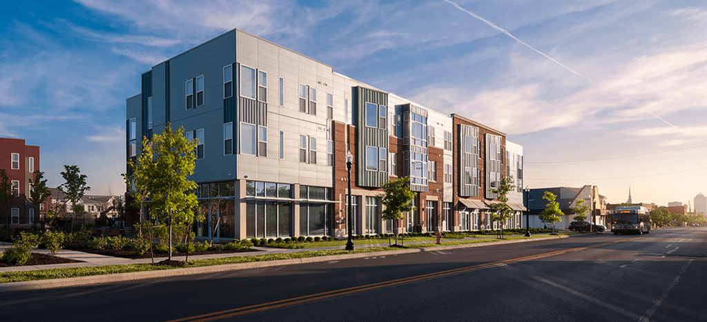 a rendering of an apartment building on a city street
