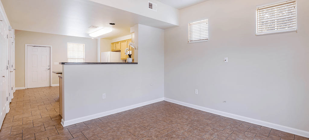 the living room and kitchen of an apartment at legends park