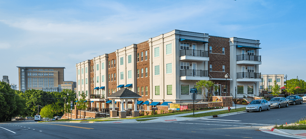a row of apartment buildings on a city street
