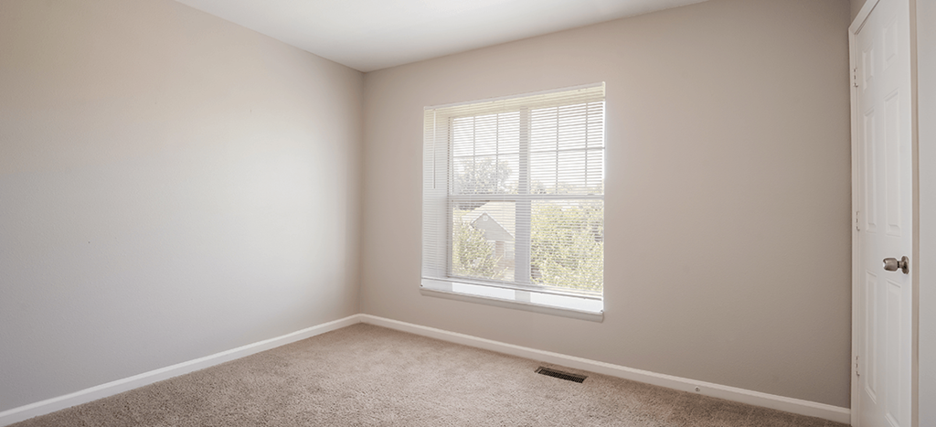 an empty room with a window in it