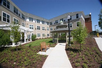 Gazebo area with apartment building in the background-Senior Living at Cambridge Heights Apartments, St. Louis, MO - Photo Gallery 5