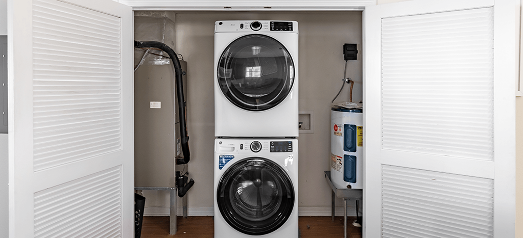 a front loading washer and dryer in a laundry room