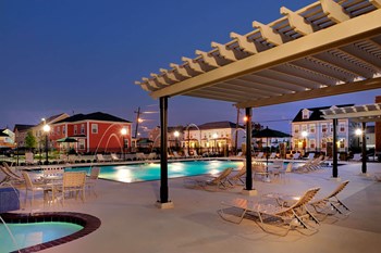 Outdoor pool area-Harmony Oaks Apartments New Orleans LA - Photo Gallery 10