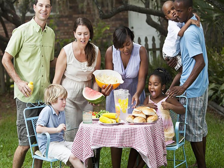 diverse group of friends having an outdoor picnic_Northpark at Scott Carver Apartments Miami, FL