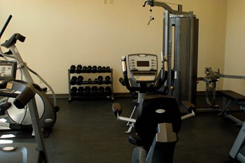 Exercise machines in fitness center-Quimby Plaza Apartments Memphis, TN - Photo Gallery 16