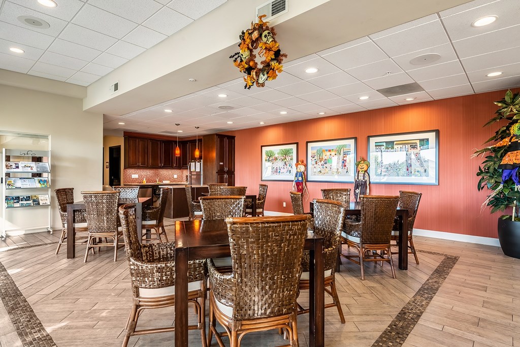 A room with a lot of chairs and tables.