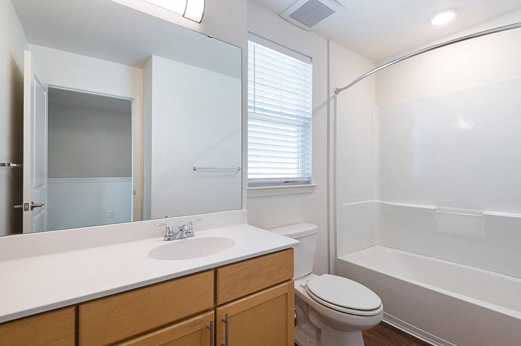 a bathroom with a toilet sink and a shower