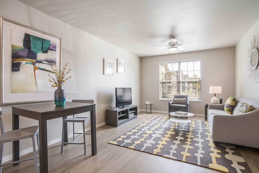 A living room with a brown table and a television.