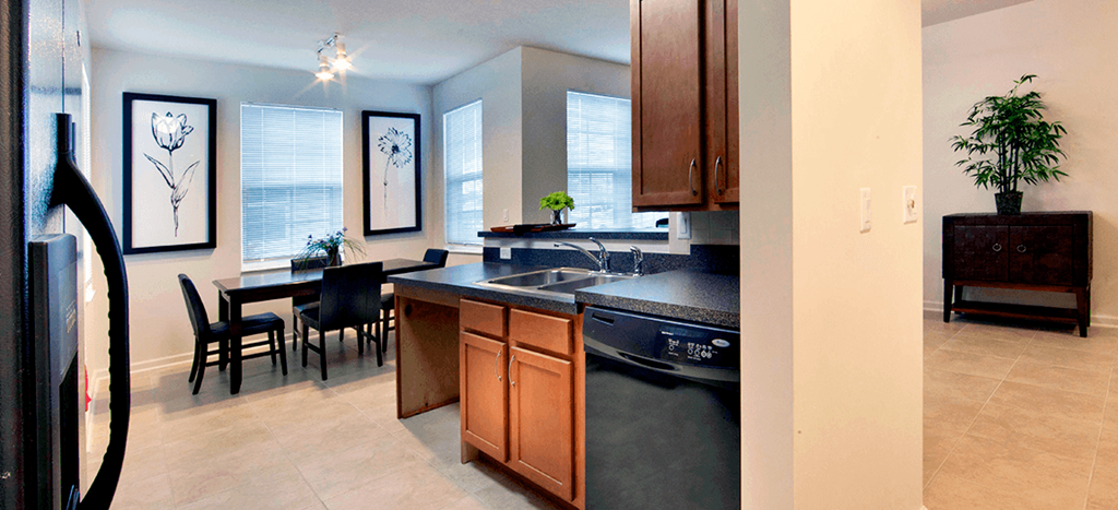 a kitchen and dining room with a large window