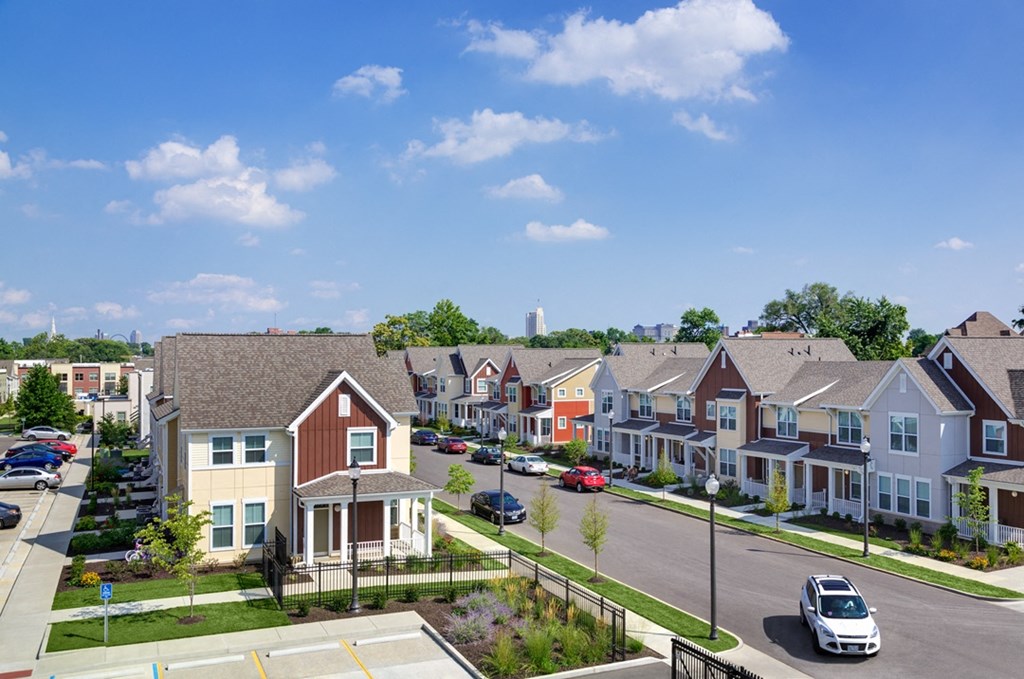 an aerial view of a row of houses on a street