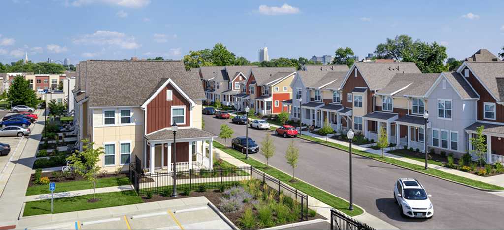 an aerial view of a row of apartment homes on a street
