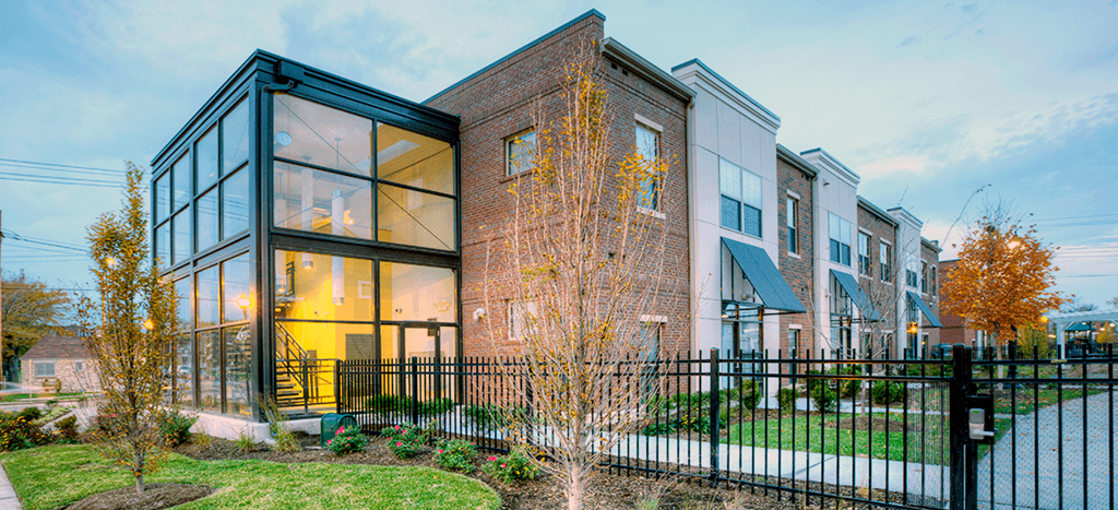 North Sarah Apartment building with a fence in front of it