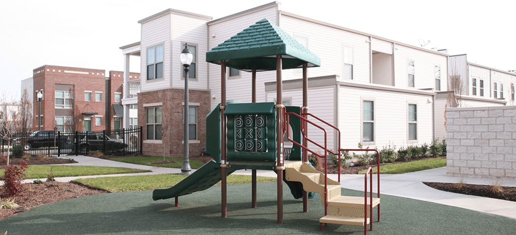 a childrens playground in front of North Sarah Apartments