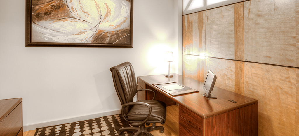 an office with a desk with a chair and a computer at North Sarah Apartments