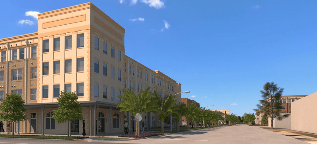 a large building on the corner of a street with palm trees Oleanders at Broadway Apartments