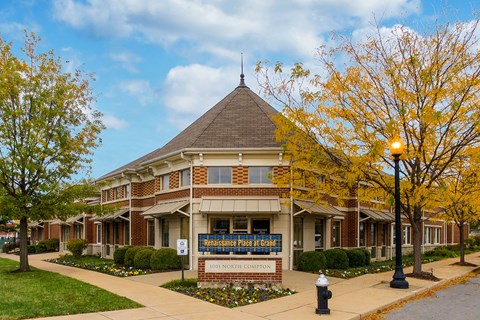 a building with a sign in front of it at Renaissance Place at Grand Apartments & Townhomes