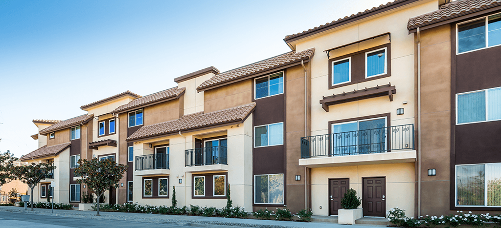 a row of townhomes with balconies and windows at Rio Vista Apartments