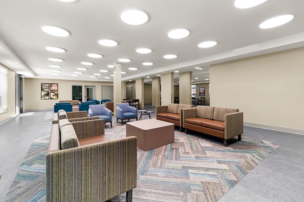 a lounge area with couches and chairs in a lobby at South City Senior in Memphis, TN