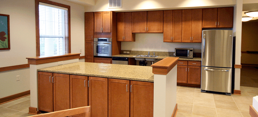 a kitchen with wooden cabinets and a counter top
