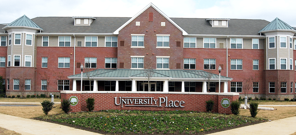 Senior Living at University Place apartment building with a sign in front of it