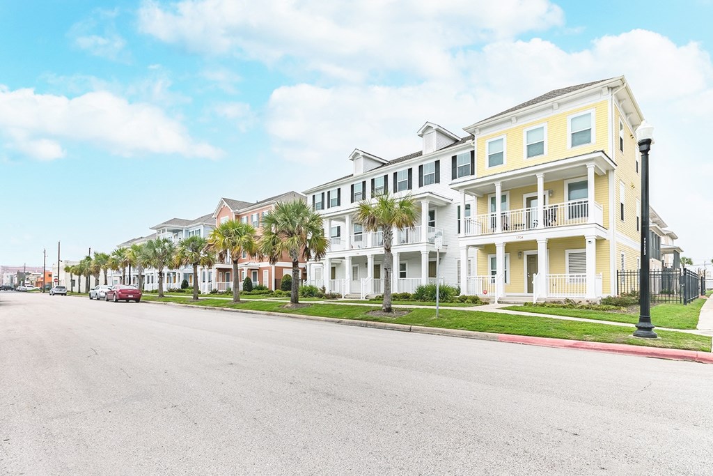 a row of houses on the side of a street