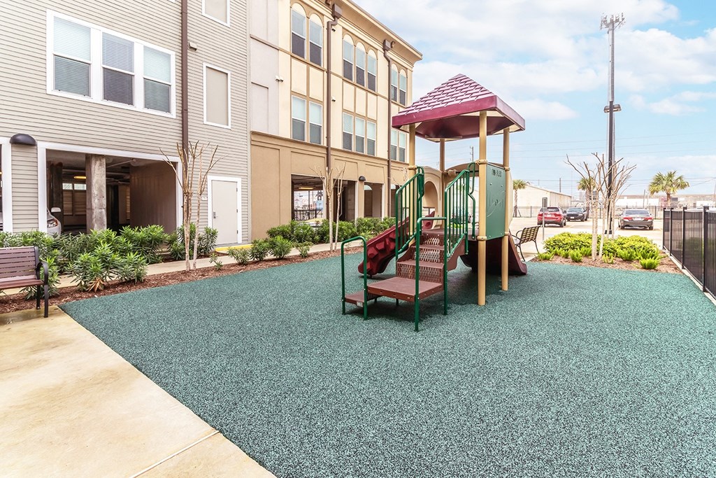 a red bench sitting in front of a building