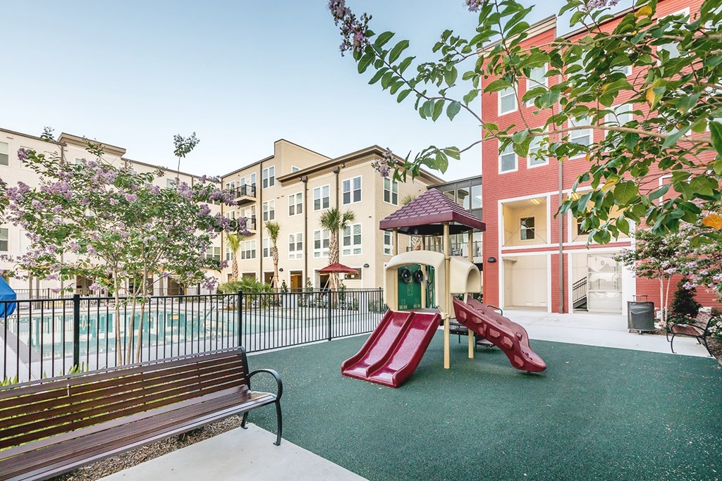 our apartments feature a playground and a pool for residents to play