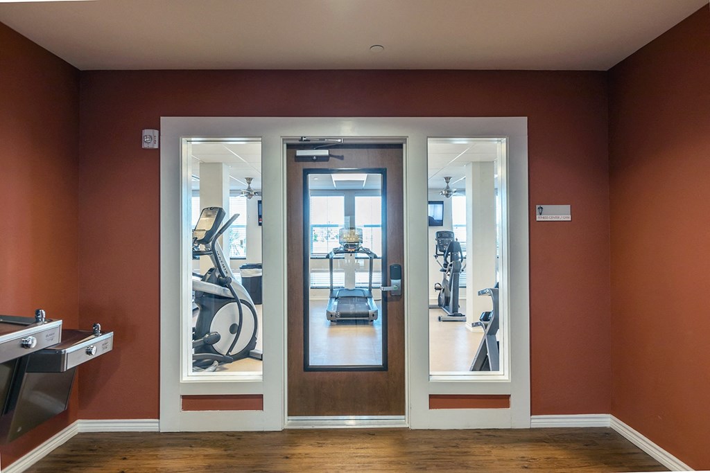 a hospital room with a door to a surgery room