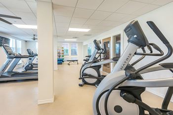 The fitness center with cardio equipment at Villas on the Strand apartments in Galveston, TX